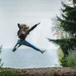 Woman jumping off the ground