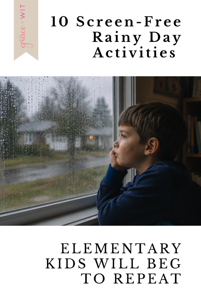 boy looking out the window at rain.