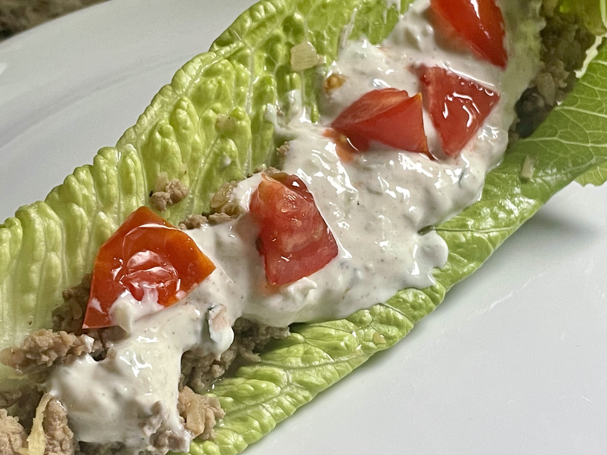 Closeup of Gyro Lettuce Boat with tomatoes.