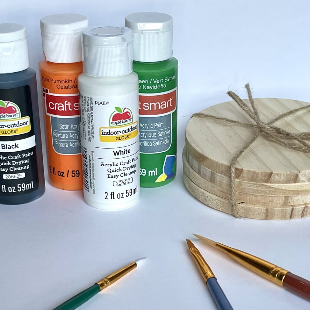 Paint, plain wood coasters, and paint brushes are the main materials for DIY Halloween coasters. 