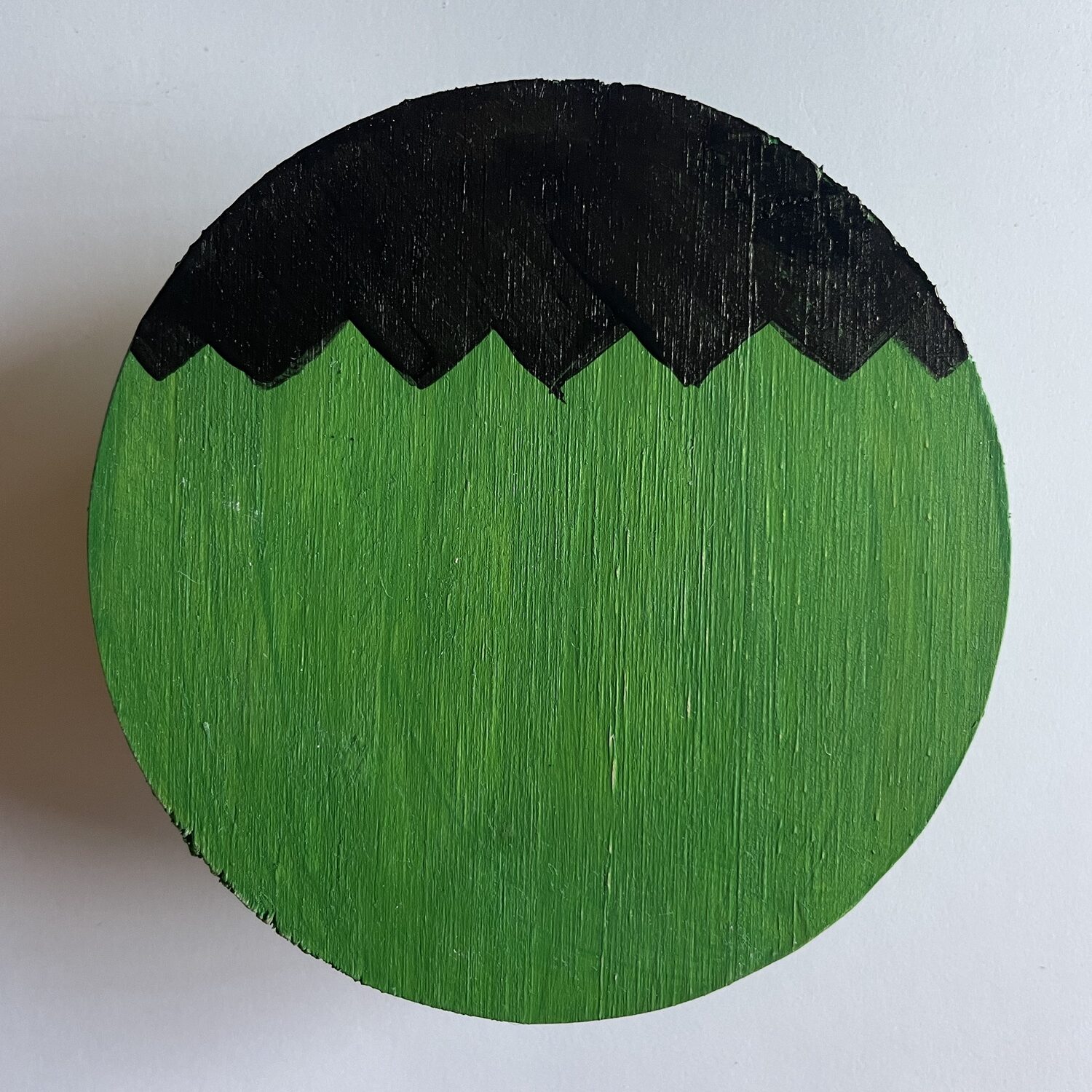 The start of a Frankenstein coaster.  The black hair is drawn in. 