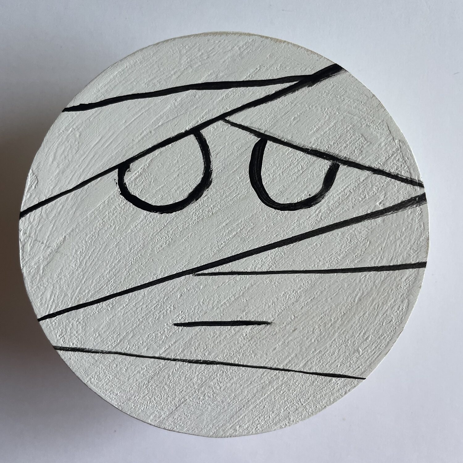 Add a mouth line and any other mummy wrapped lines.