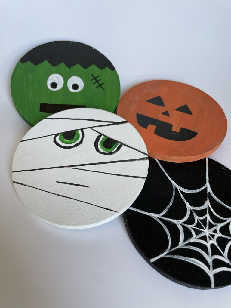 Four finished DIY Halloween coasters. 