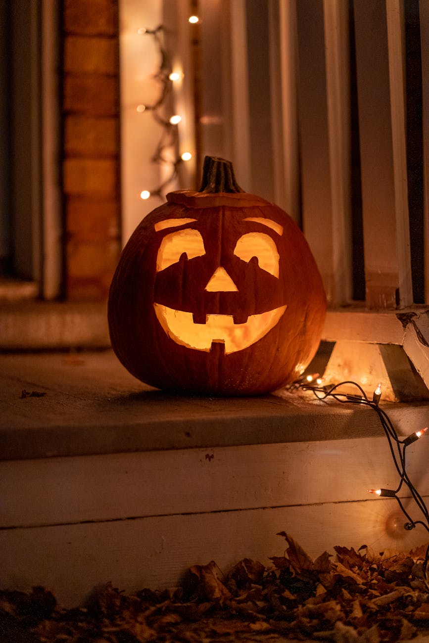 Carved pumpkin on porch to illustrate point on using ChatGPT to find out how long carved pumpkins last on a porch. 