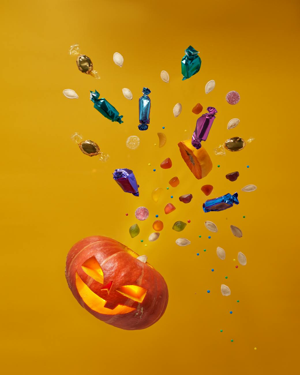 treats bursting out of a jack o lantern