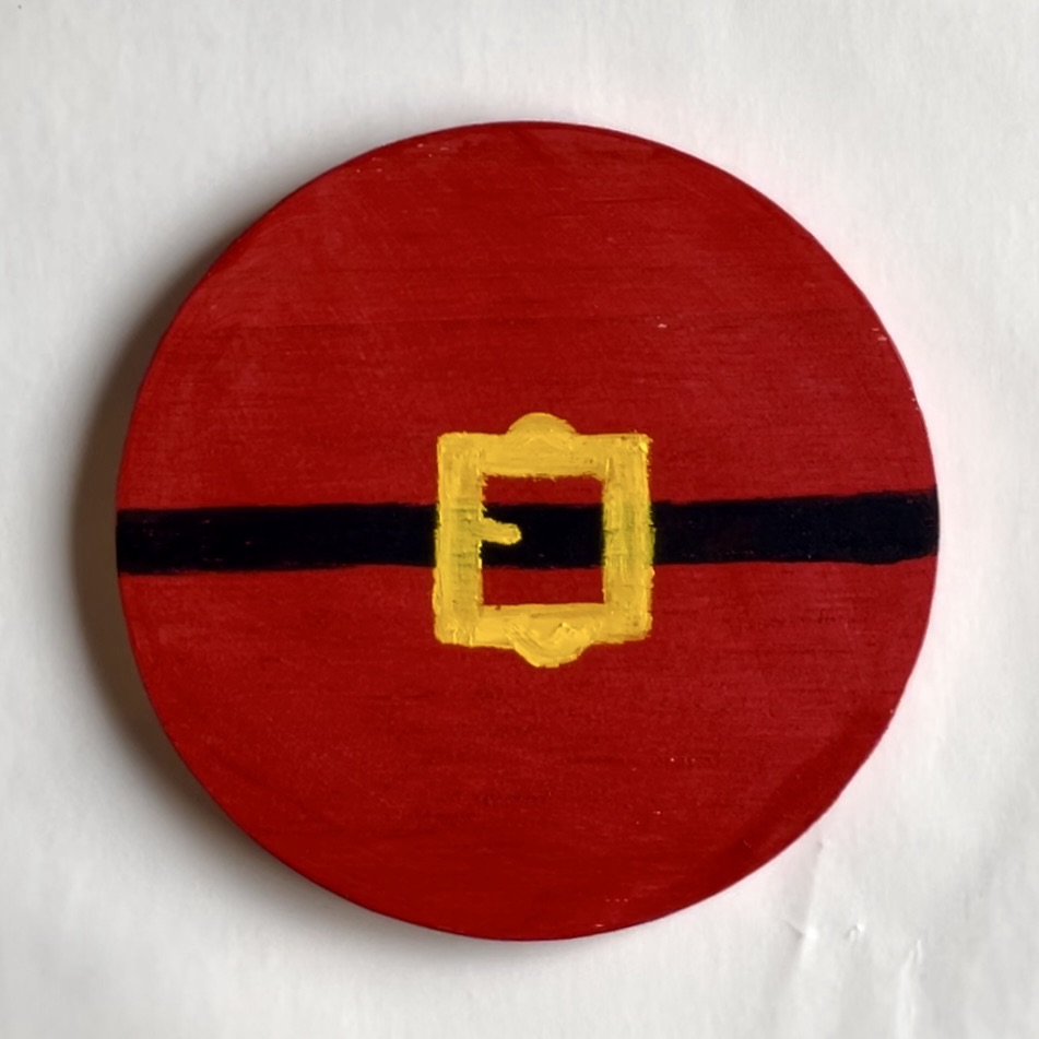 Finished christmas coaster with Santa’s belt painted on it. 