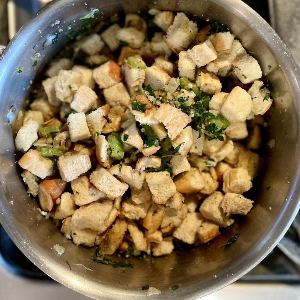 Bread and spices in pan. Not mixed together.