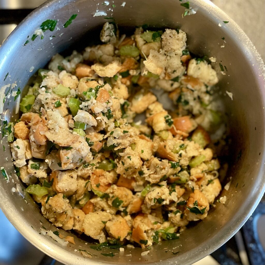 Bread and spices in pan, mixed together. 