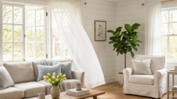 a living room with a spring refresh with open windows and blowing white curtains.