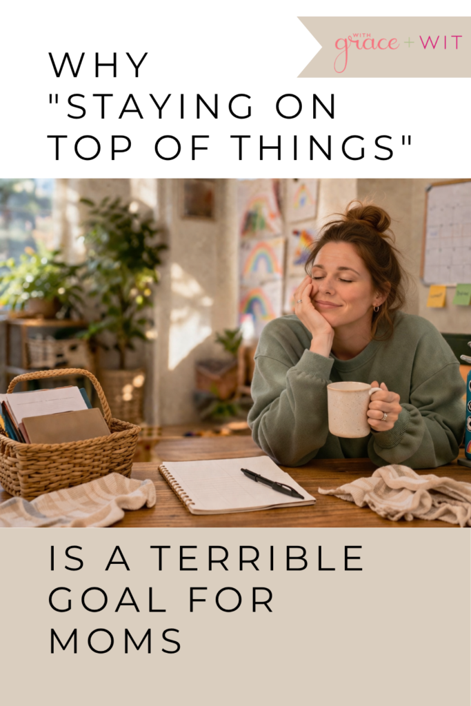 A woman trying to stay on top of things, with a basket of papers, a notebook on a table. She is holding a cup of tea.