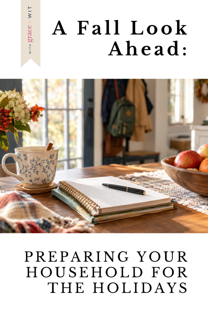 A fall day, with tea, a bowl of apples and a notebook to plan the upcoming holidays.